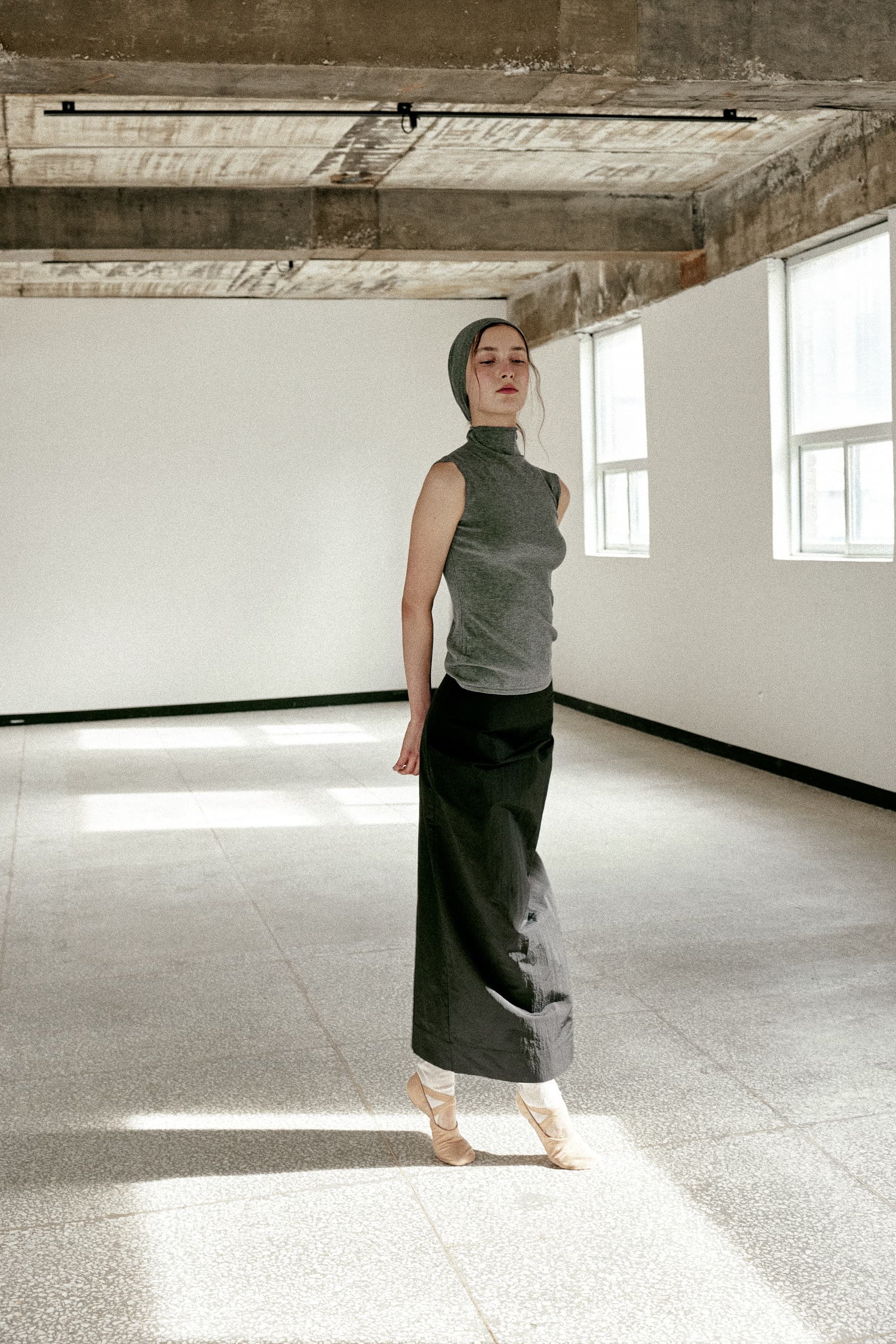 CELA ASYMMETRIC SKIRT [BLACK]